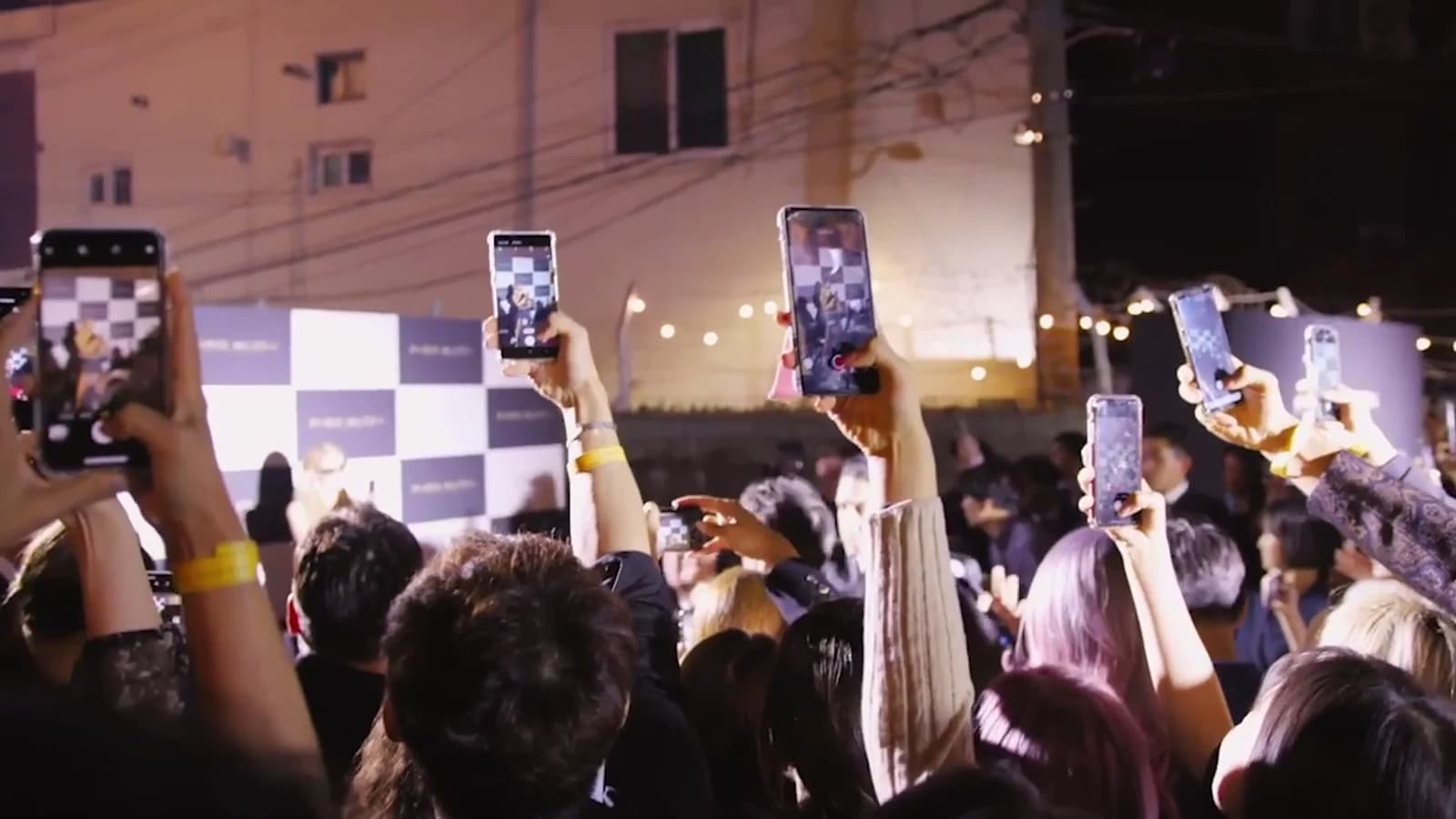 Fans holding up phones to record Paris Hilton at the Seoul launch